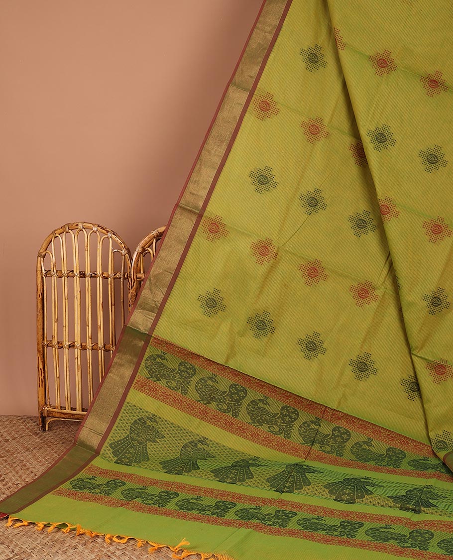 Green Coimbatore cotton saree with buttas,  contrast border & peacock motifs border