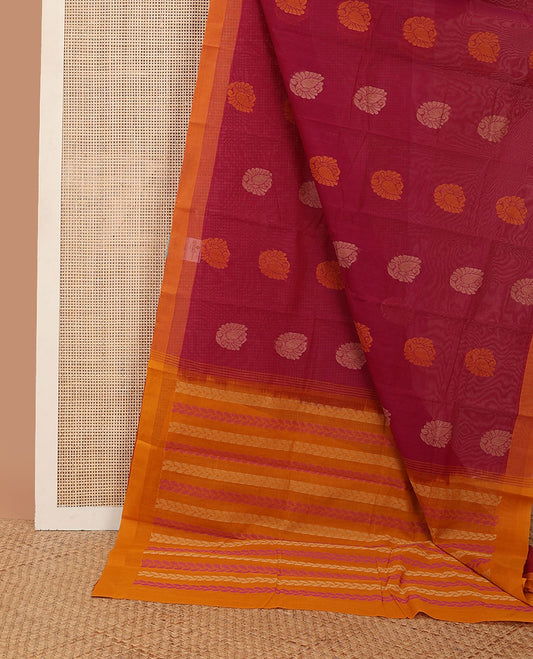 Red buttas kanchi cotton saree, contrast plain border & pallu steeped with leaf motifs