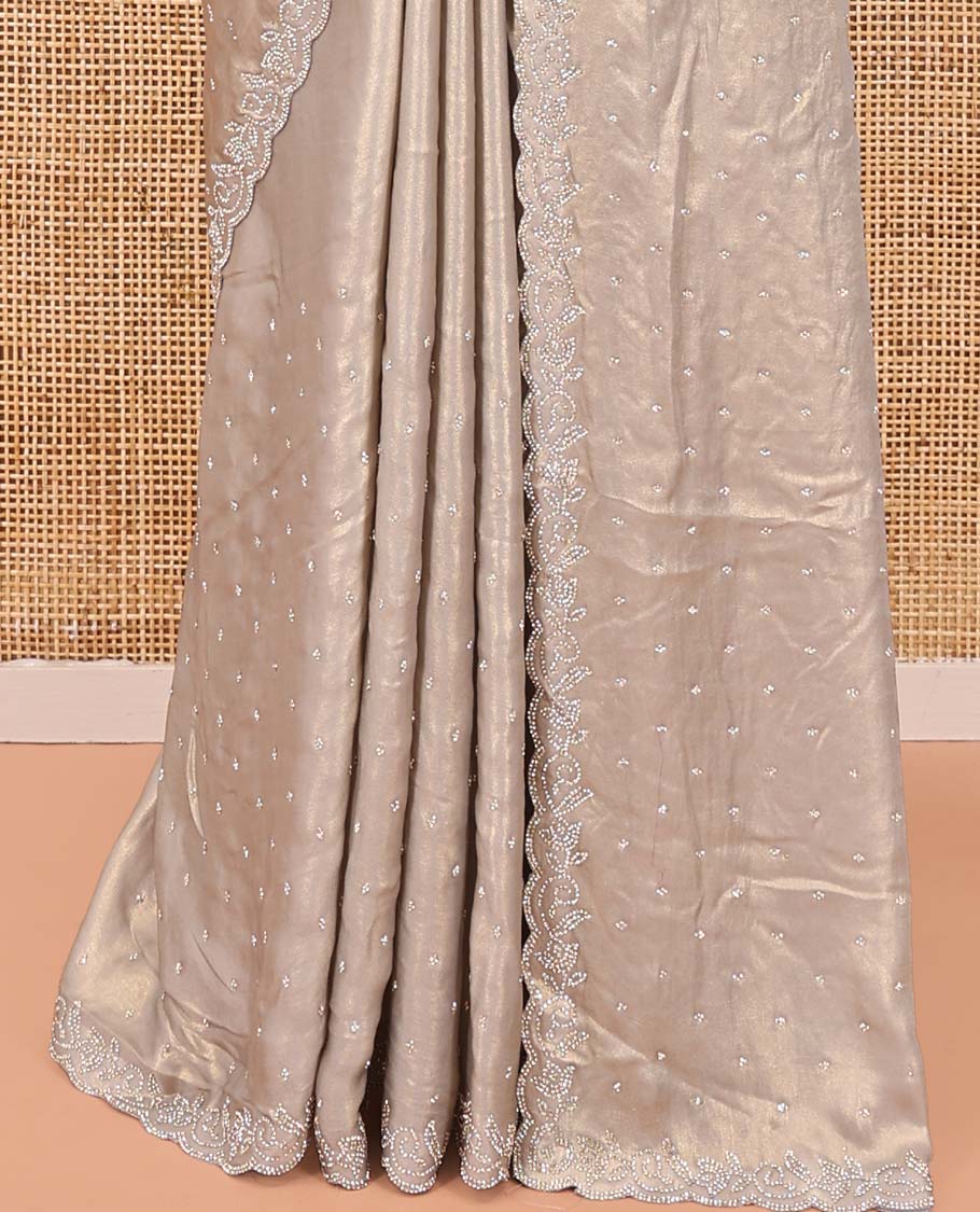 Champagne Designer Saree, Gleamed up with Stone Struck All Over Its Body, Scallop Stone Embroidered Border, and Heavy Embroidered Matching Blouse