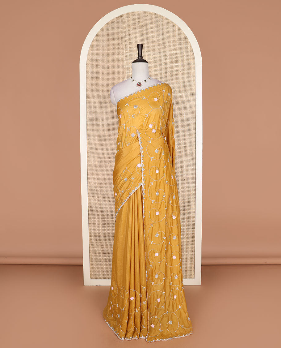 Yellow floral vine kardana embroidered designer saree, stone work border, and floral vine kardana embroidered pallu