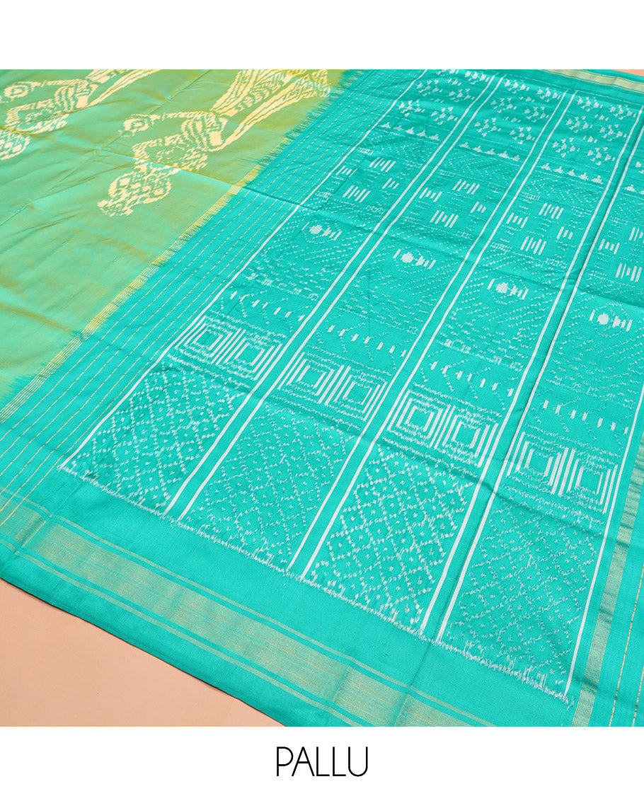 Green Ikkat Silk Saree Beautified with Human Figurines, Complemented by a Contrast Border, Hazily Woven Pallu of Geometric Patterns, and a Contrast Blouse