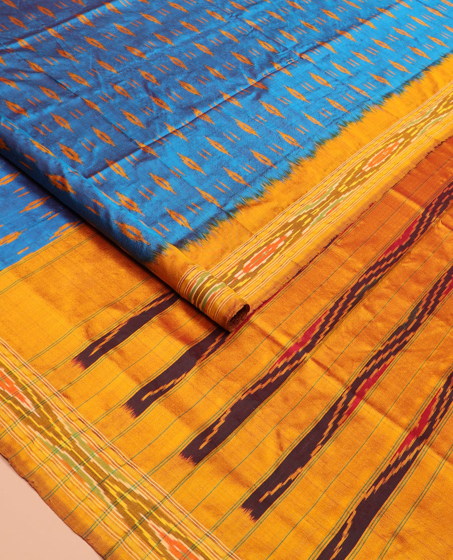 Blue Ikkat Silk Saree Enlivened with Ikkat Buttas, Featuring a Contrast Ikkat-Textured Border and a Pallu Steeped in Ikkat Textures and Stripes