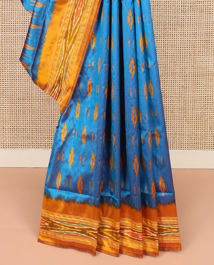 Blue Ikkat Silk Saree Enlivened with Ikkat Buttas, Featuring a Contrast Ikkat-Textured Border and a Pallu Steeped in Ikkat Textures and Stripes