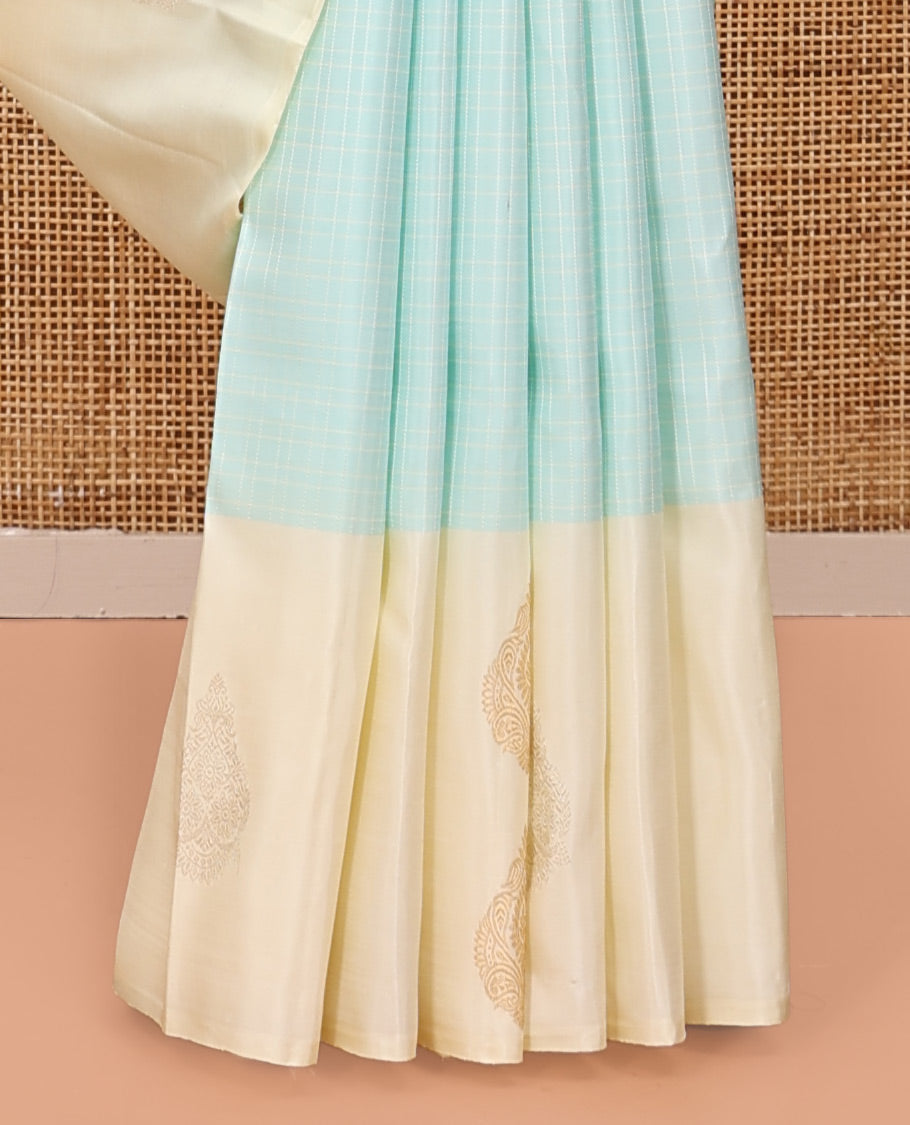 Pale Blue Kanchipuram Silk Saree, Sparsely Woven with Checks, Complemented by a Contrast Zari Buttas Woven Border, Jaal Pallu, and Contrast Blouse