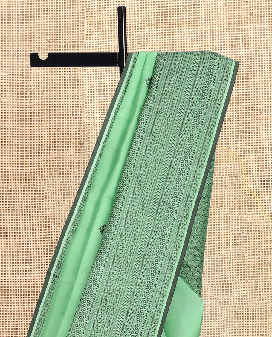 Pista Green Kanchipuram Silk Saree, Woven with Thread Buttas, a Self-Border of Manga, Ara Maadam, Kathir, Mayil Kann, Jaal Pallu, and a Matching Blouse