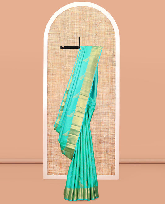 Turquoise Kanchipuram Silk Saree, Detailed with Zari Checks, and Mayil Buttas, a Zari Border of Thilakam Mokku, Kathir, and Zari Stripes, Zari Striped Pallu, and a Matching Blouse