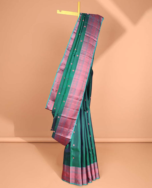 Green floral buttas kancheepuram silk saree with contrast border of thilakam mokku, muthu, paun, banaras design & zari design pallu