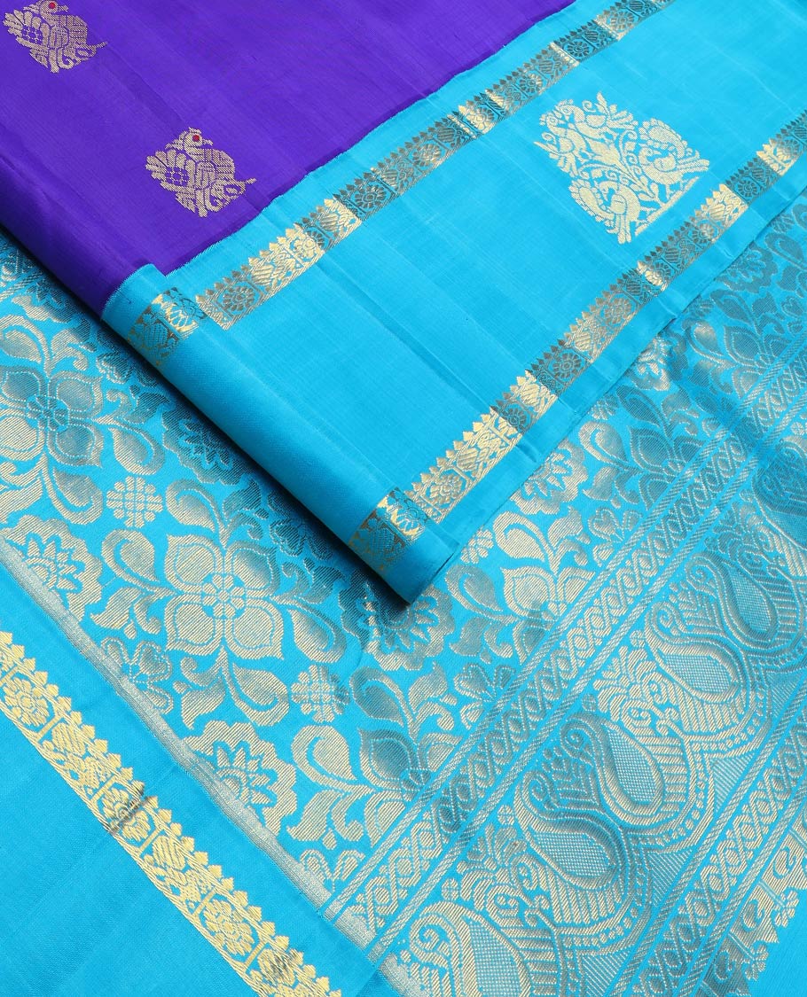 Violet mayil buttas kanchipuram silksaree, contrast one-sided korvai border of thilakam & annam chakram designs & floral design pallu