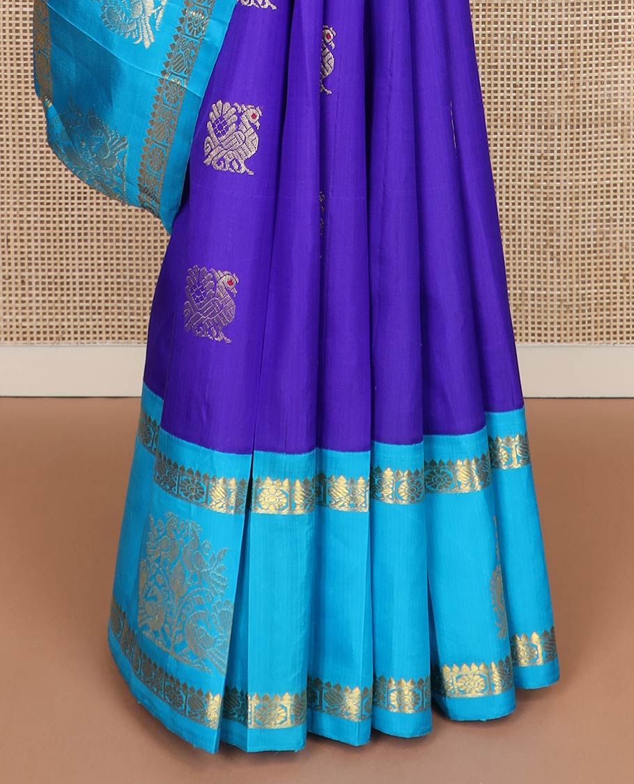 Violet mayil buttas kanchipuram silksaree, contrast one-sided korvai border of thilakam & annam chakram designs & floral design pallu