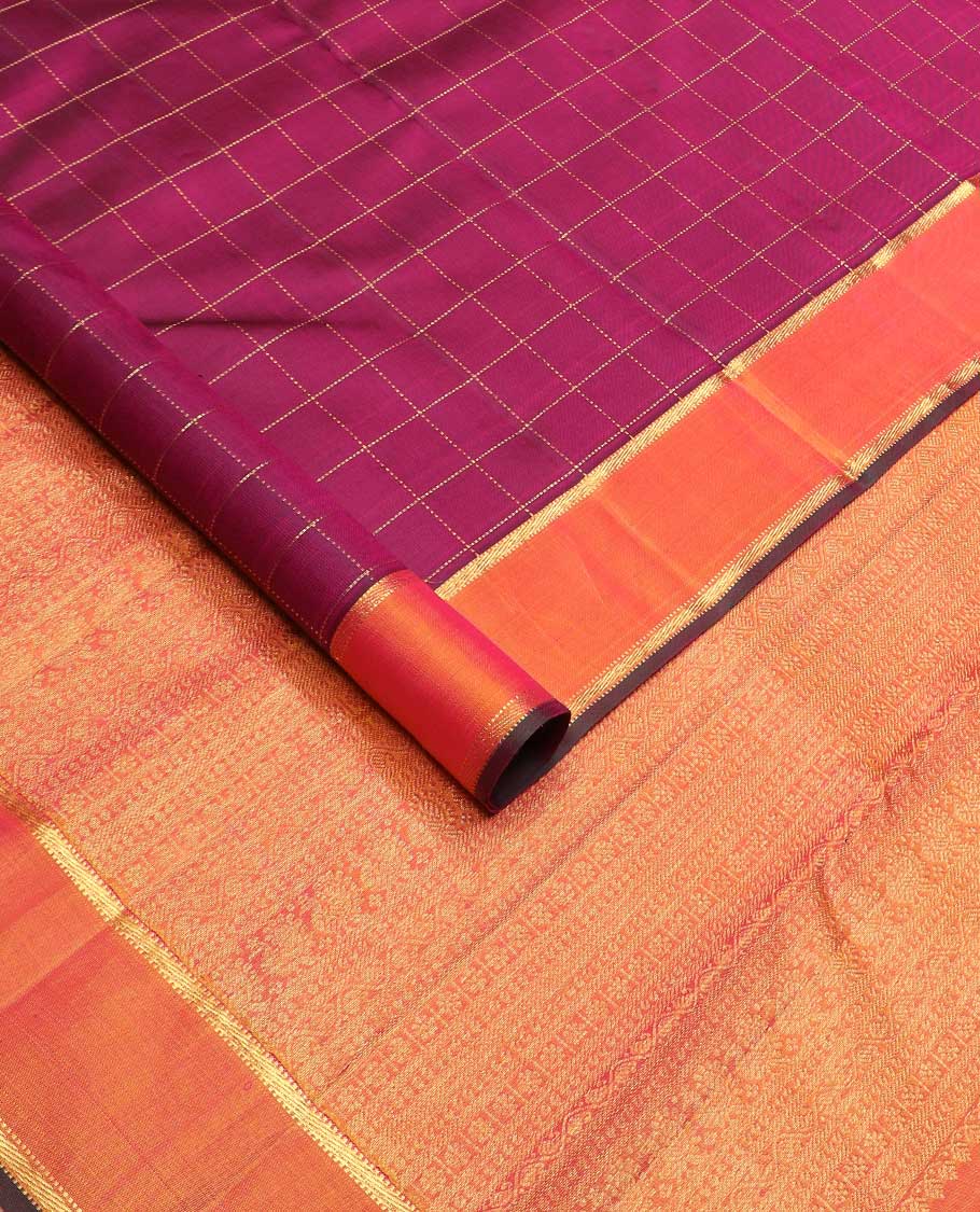 Purple muthu kattam Kanchipuram silk saree, contrast rettai pettu zari border, and pallu steeped with traditional zari designs