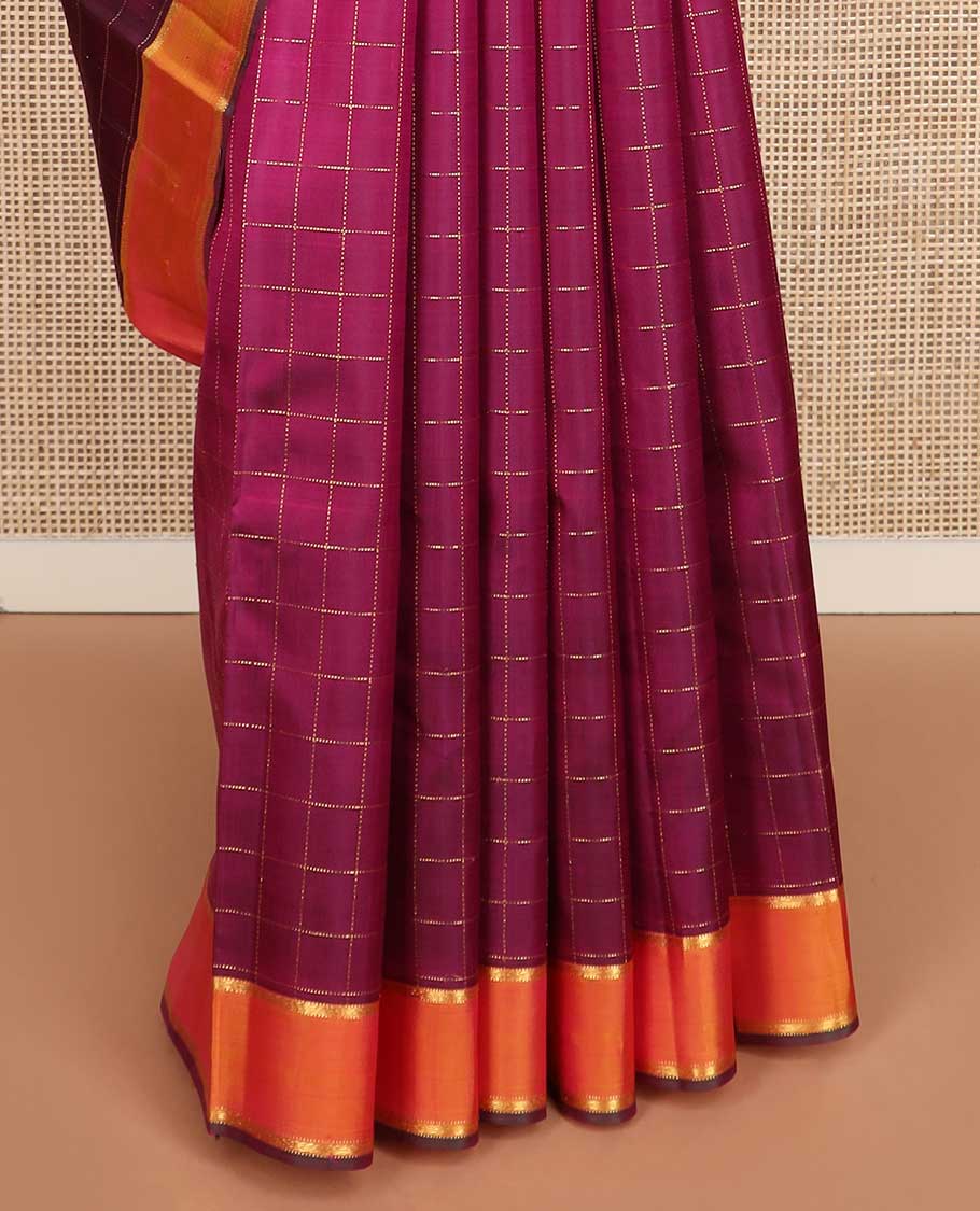 Purple muthu kattam Kanchipuram silk saree, contrast rettai pettu zari border, and pallu steeped with traditional zari designs