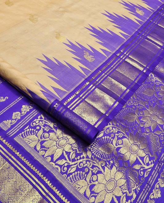 Light sandal yaanai buttas Kanchipuram silk saree, contrast one-sided thazampoo rekku border of thilakam mokku, banaras, and jaal designs, and floral jaal pallu