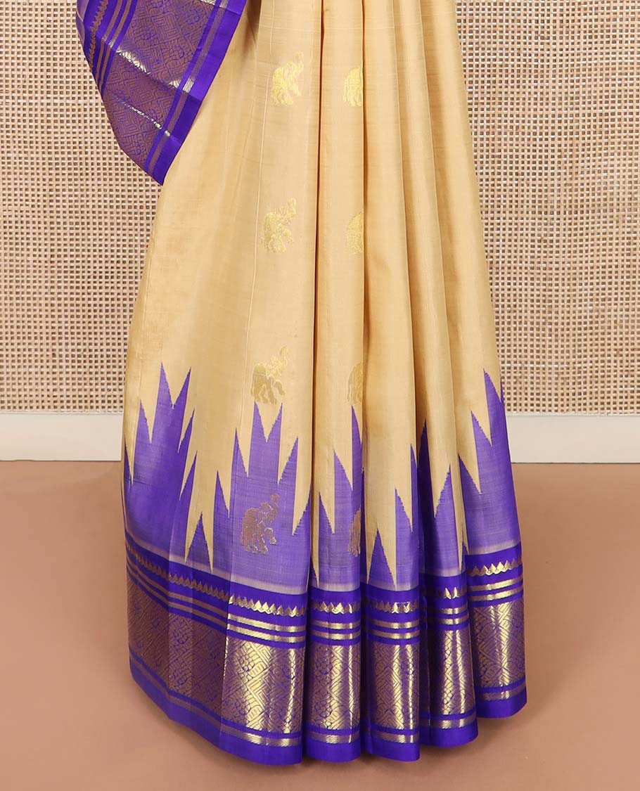 Light sandal yaanai buttas Kanchipuram silk saree, contrast one-sided thazampoo rekku border of thilakam mokku, banaras, and jaal designs, and floral jaal pallu