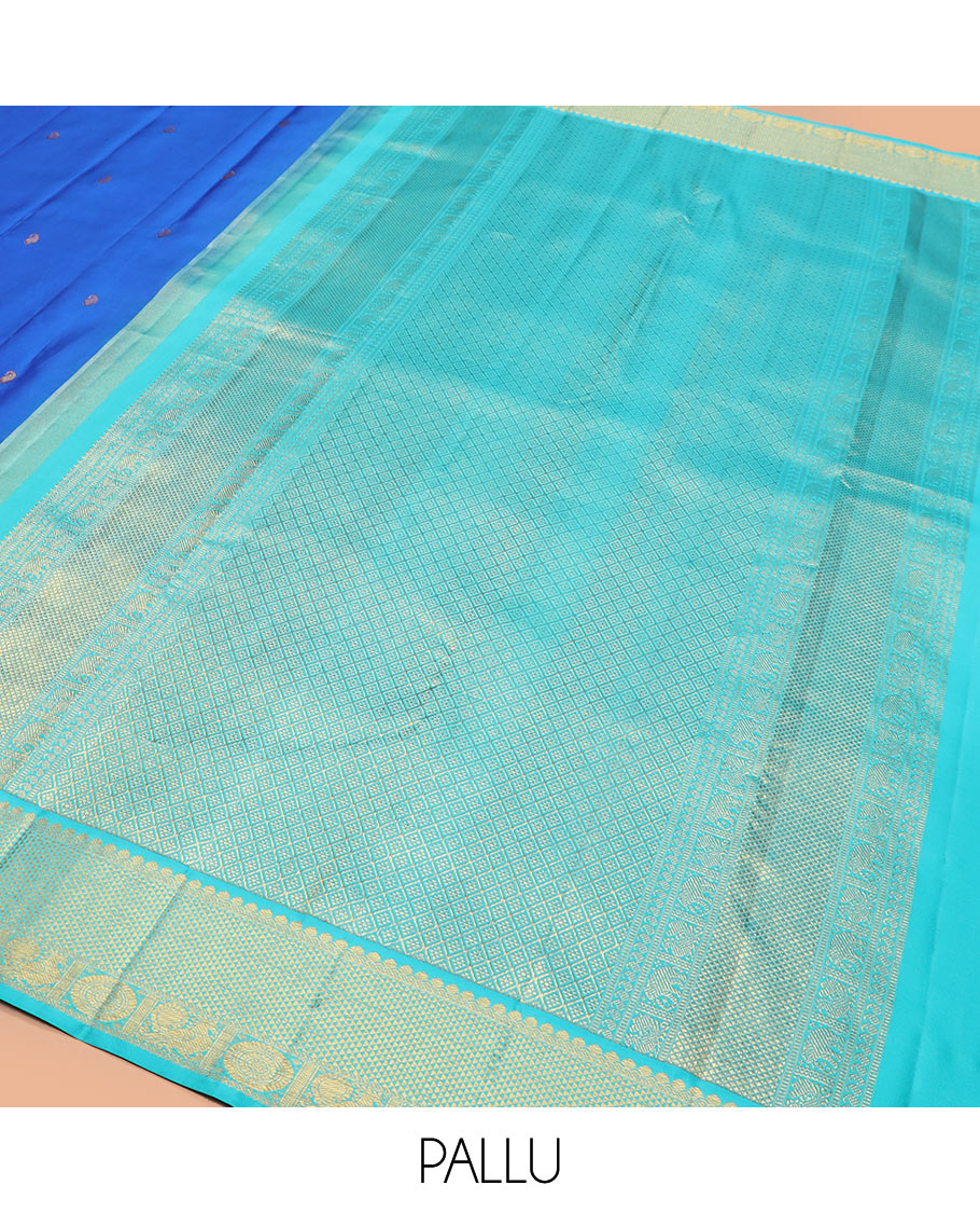 Blue vanki manga buttas Kanchipuram silk saree, contrast korvai border of salngai, banaras, ara maadam, and anna chakram designs, and jaal pallu