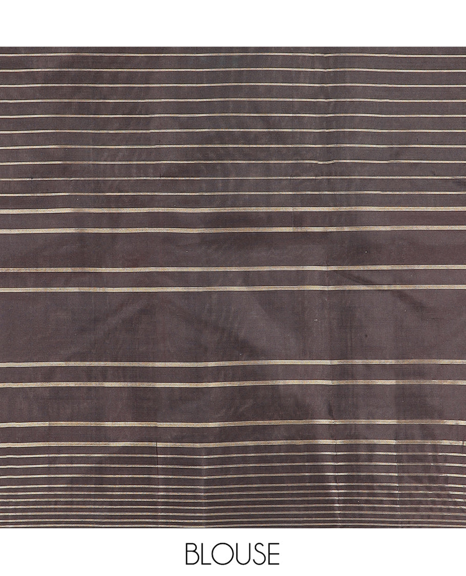 White Kanchipuram Silk Saree Decorated with Stripes All Over Its Body, Complemented by a Contrast Border of Muthu Kattam and Annam Buttas, Pallu of Jaal Design, and Paired with a Contrast Blouse