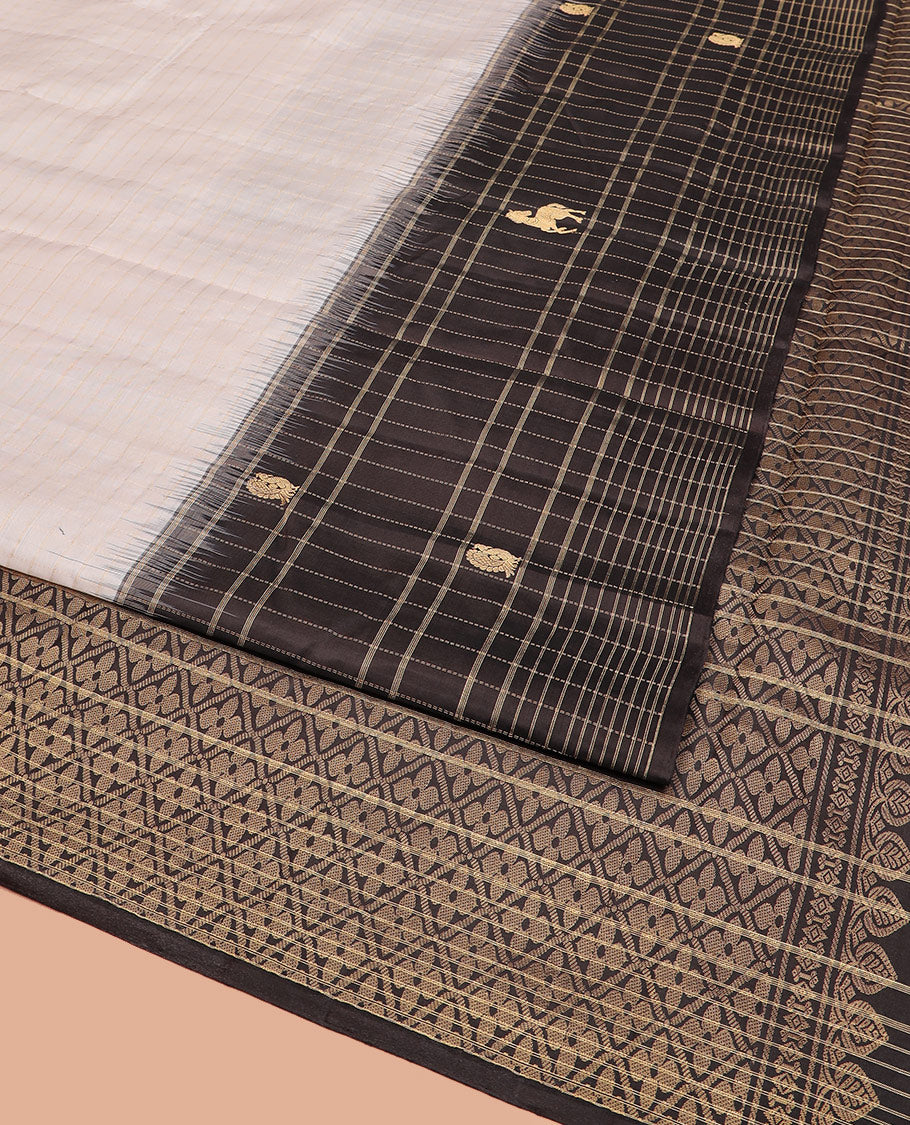 White Kanchipuram Silk Saree Decorated with Stripes All Over Its Body, Complemented by a Contrast Border of Muthu Kattam and Annam Buttas, Pallu of Jaal Design, and Paired with a Contrast Blouse