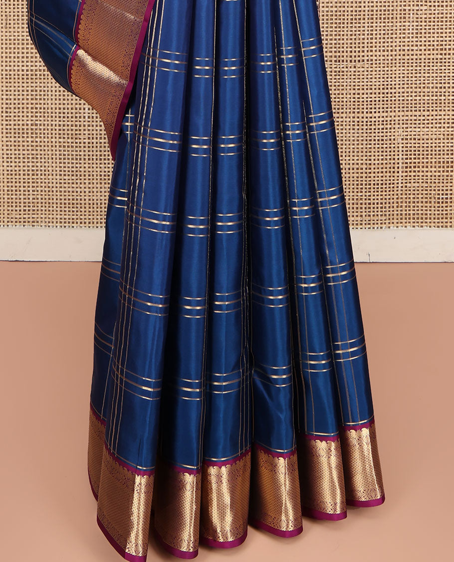 Blue Kanchipuram Silk Saree, Ornamented with Zari Checked Design on Its Body, Complemented by a Contrast Border of Manga, Rekku, Cross Kamalam, and Mayil Kann Designs, Grand Jaal Pallu, and Paired with a Contrast Blouse
