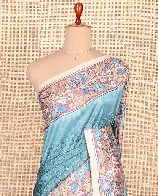 Blue Semi-Tussar Saree Meticulously Designed in Bandhani Dots, Complemented by a Contrast Kalamkari Floral Creeper Printed with Kantha Work Border, Pallu Featuring Floral Print Kantha Work, and Paired with a Contrast Printed Blouse