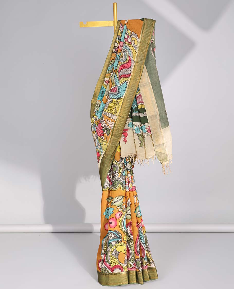 Mustard floral,peacock design handpainted pen kalamkari silk saree with contrast zari border & peacock design pallu