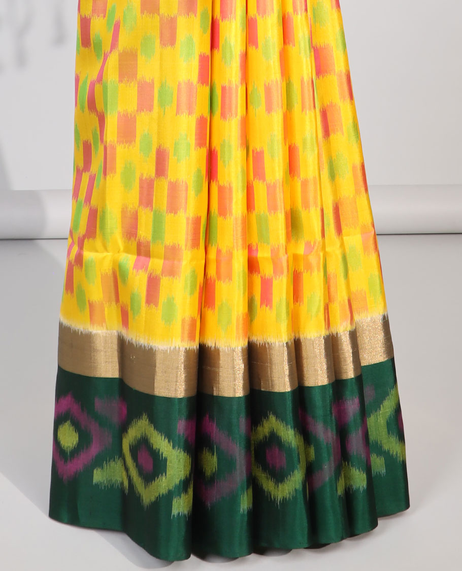 Multi-color checked design soft silk saree with contrast ikkat style border & ikkat style floral design pallu