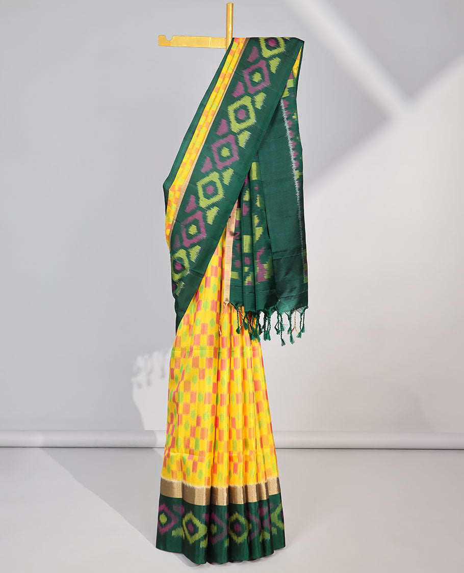Multi-color checked design soft silk saree with contrast ikkat style border & ikkat style floral design pallu