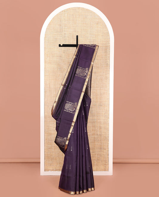 Eggplant Purple Mayuri Soft Silk Saree, Ornamented with Zari Buttas on Its Body, Highlighted by a Zari Piping Border of Kuyil Kann Designs, Gracefully Embellished Pallu, and Paired with a Matching Blouse