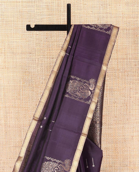 Eggplant Purple Mayuri Soft Silk Saree, Ornamented with Zari Buttas on Its Body, Highlighted by a Zari Piping Border of Kuyil Kann Designs, Gracefully Embellished Pallu, and Paired with a Matching Blouse
