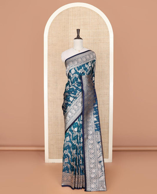 Peacock blue floral jaal jacquard mushru silk saree, floral design border, and pallu of intricate designs