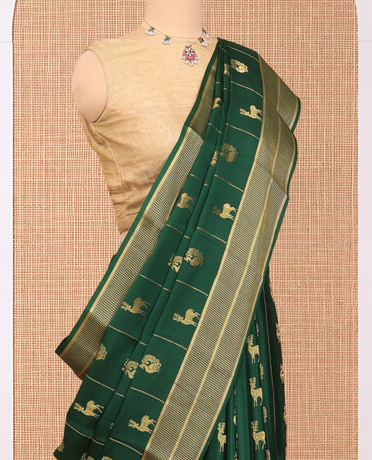 Green Mysore Silk Saree, Artfully Woven with Peacock-Deer Zari Buttas, Complemented by a Zari Geometric Border, a Grand Pallu, and a Matching Blouse