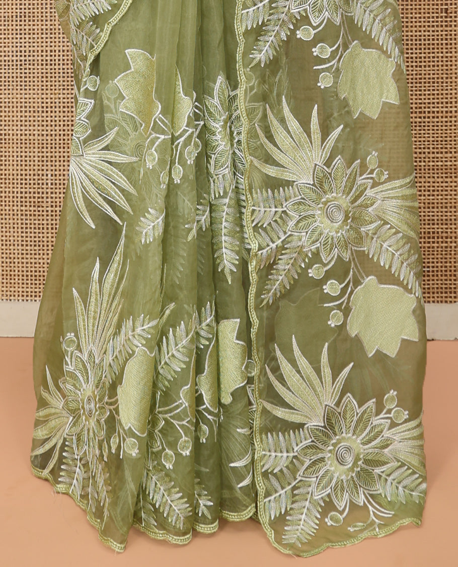 Green Organza Saree Beautified with Tropical Floral Embroidery, a Subtle Scallop Border, and a Matching Blouse