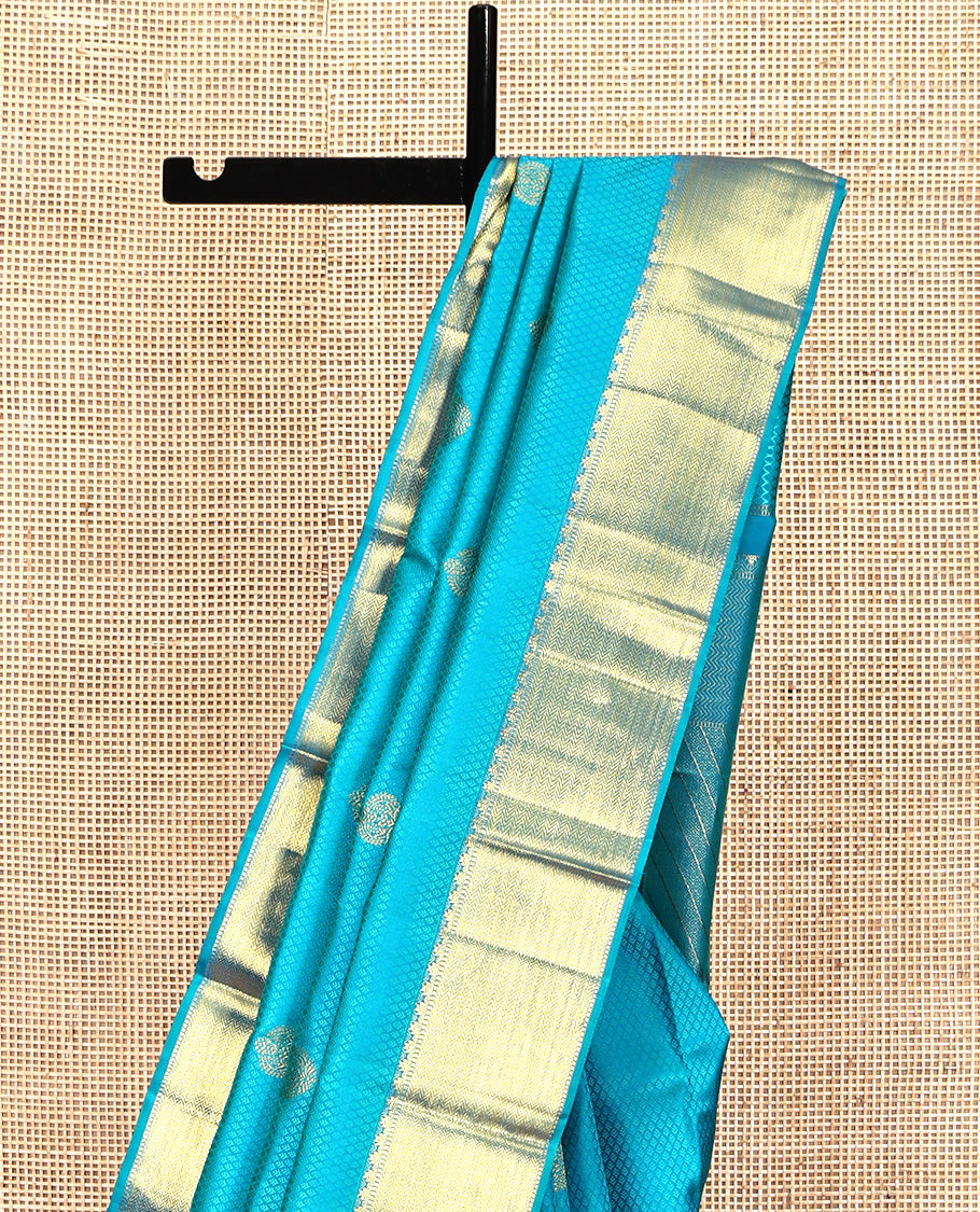 Blue Parampara Silk Saree, Adorned with Zari Buttas and Embossed Texture On Its Body, Highlighted by Zari Border of Thazampoo Rekku, Muthu, and Vanki Designs, Pallu Features Vanki Designs and Paired with a Matching Blouse