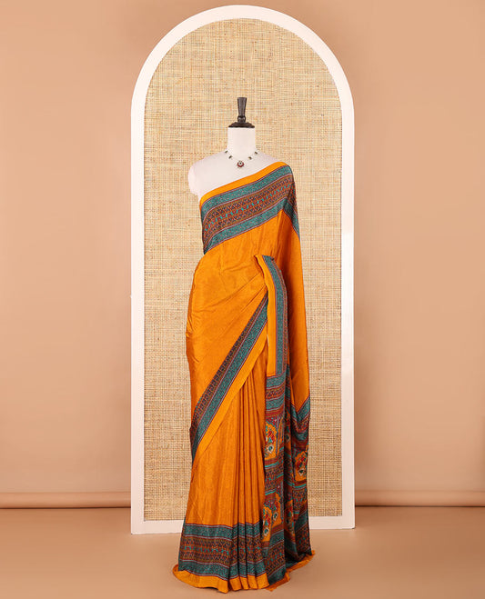 Mustard negative-style sparsely printed crepe silk saree, contrast printed border, printed pallu & printed blouse