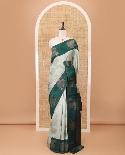 Pista green zari checked & elephant motifs woven kanchi silk saree, contrast korvai-style border of elephant motifs, intricate pallu & plain blouse