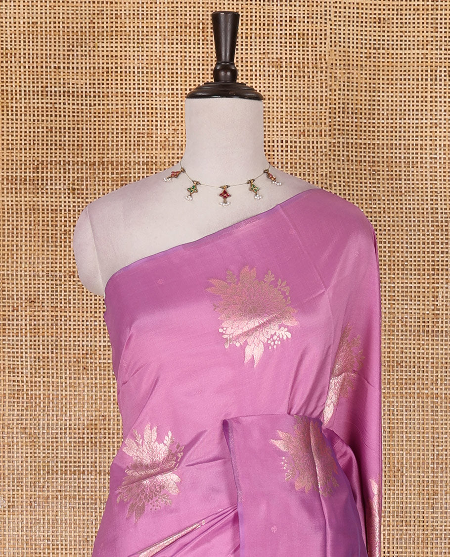 Borderless pink floral motifs steeped elite soft silk saree, contrast lotus-like motifs pallu, and contrast buttas blouse