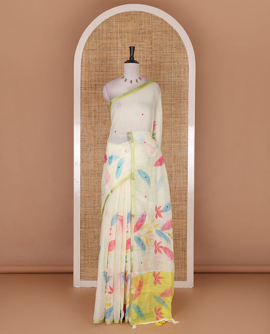 Light green colorful floral vine printed with mirror embroidered linen saree, contrast zari piping border, and contrast printed blouse