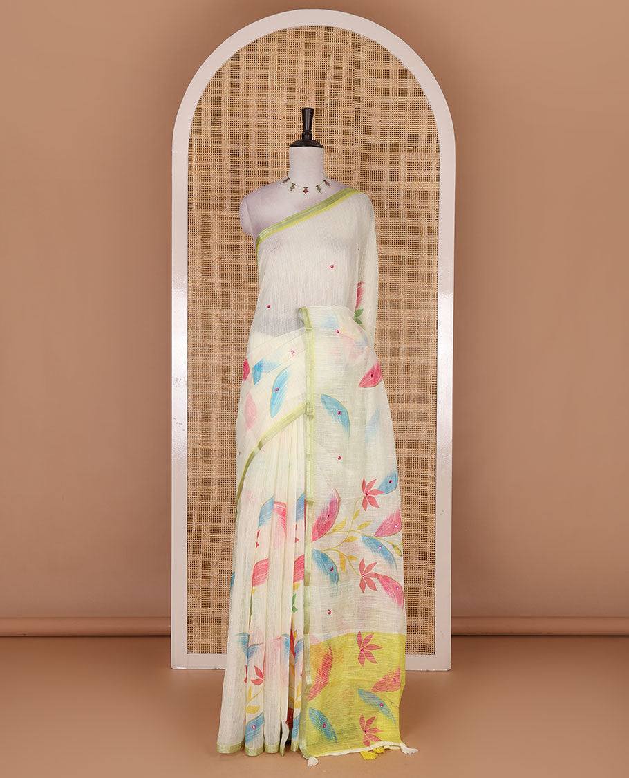 Light green colorful floral vine printed with mirror embroidered linen saree, contrast zari piping border, and contrast printed blouse