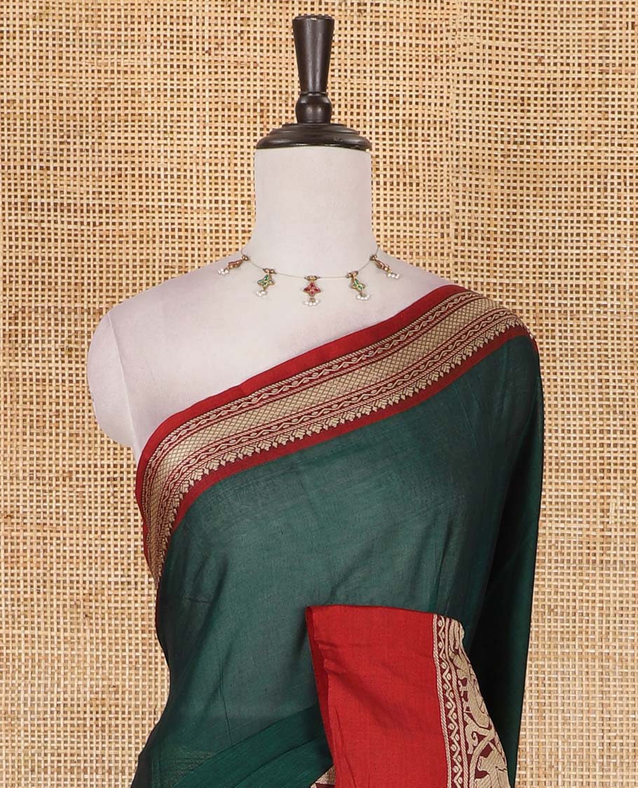 Green plain mercerised cotton saree, contrast traditional border of peacock, and elephant motifs, striped pallu, and a matching blouse