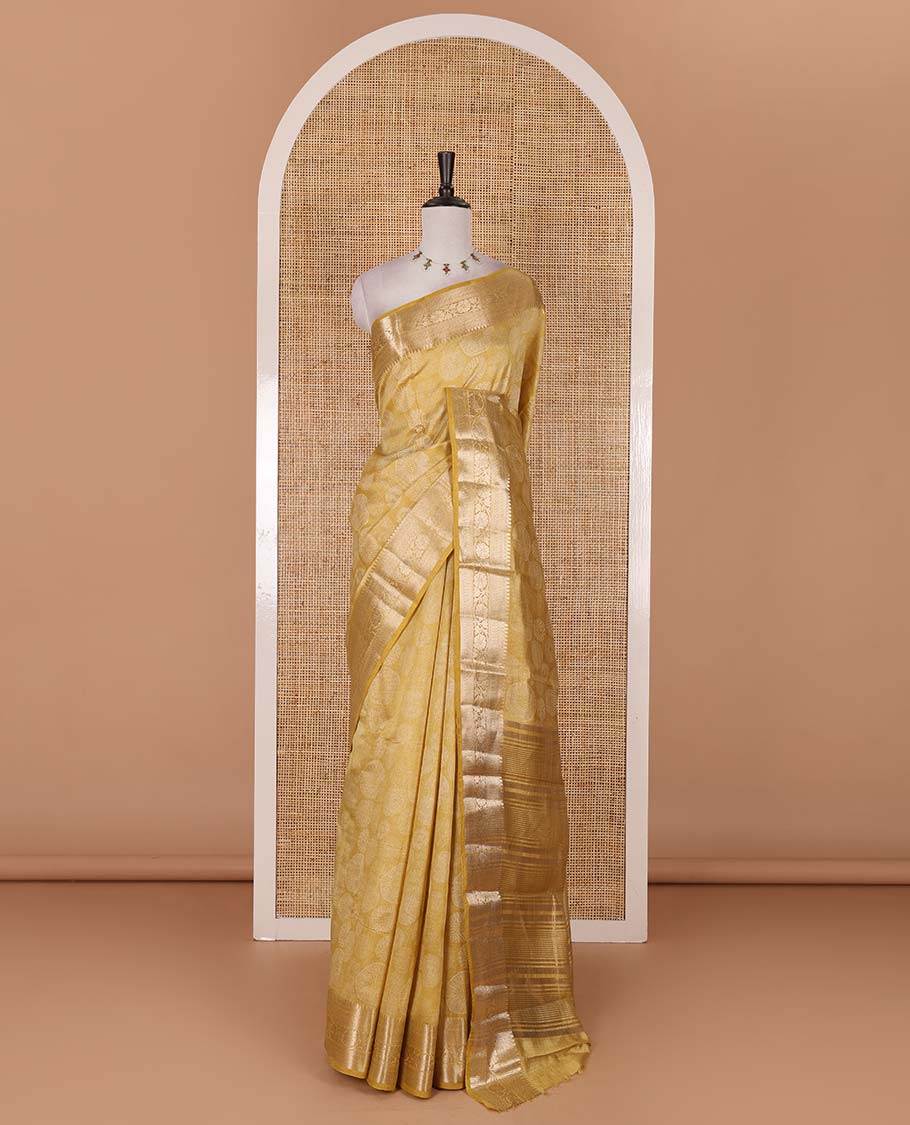 Gold uniquely printed semi-tussar saree, traditional zari border, zari striped pallu, and a matching blouse