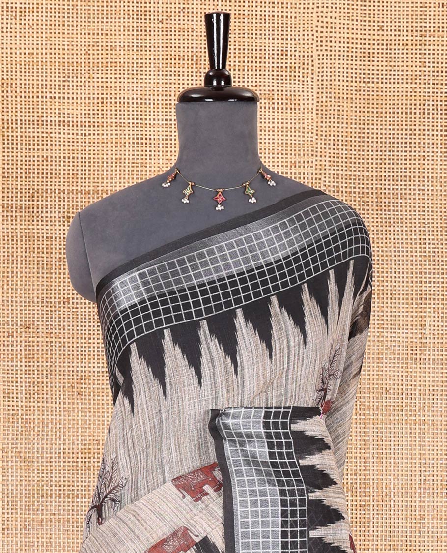 Chikku elephant motifs printed linen cotton saree, contrast temple printed checked border, ikkat style floral printed pallu, and a contrast floral printed blouse