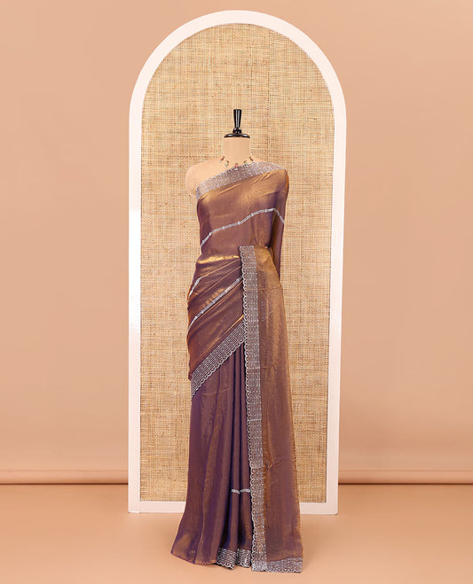 Copper horizontally swarovski stone striped fendi chiffon saree, swarovski stone work border, and a plain blouse
