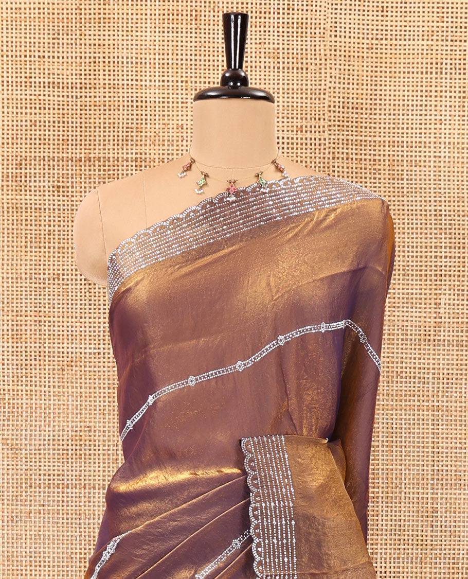 Copper horizontally swarovski stone striped fendi chiffon saree, swarovski stone work border, and a plain blouse
