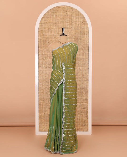 Parrot green vertical stripes embroidered shimmer chiffon saree, scallop embroidered border, embroidered pallu, and fancy embroidered matching blouse