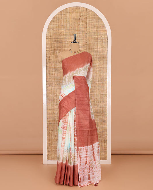 Multi color shibori printed jute tussar saree, contrast plain border, plain pallu with tussels, and contrast plain blouse