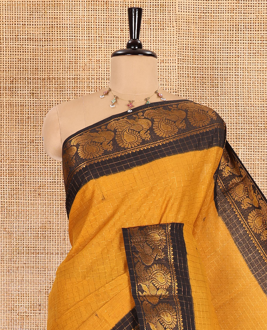 Mustard zari checked sungudi cotton saree, contrast zari border of peacock motifs, zari striped border, and a contrast blouse