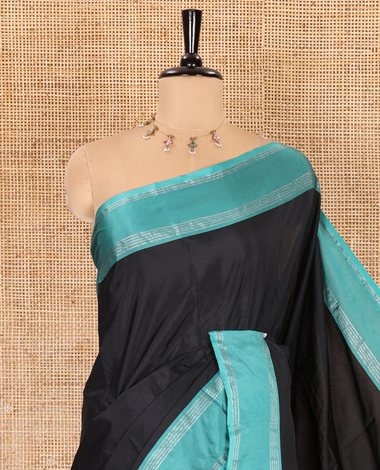 Black plain semi-soft silk saree, contrast horizontal zari striped border, striped pallu, and a matching blouse