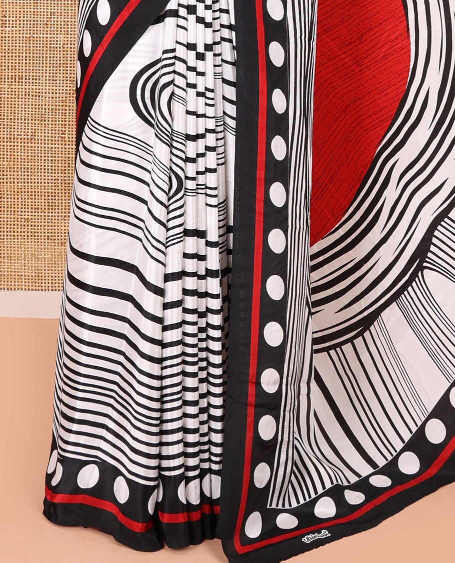 White and black horizontal stripes and wavy patterned crepe silk saree, small coin buttas printed blouse, big circle motifs printed pallu, and a plain blouse