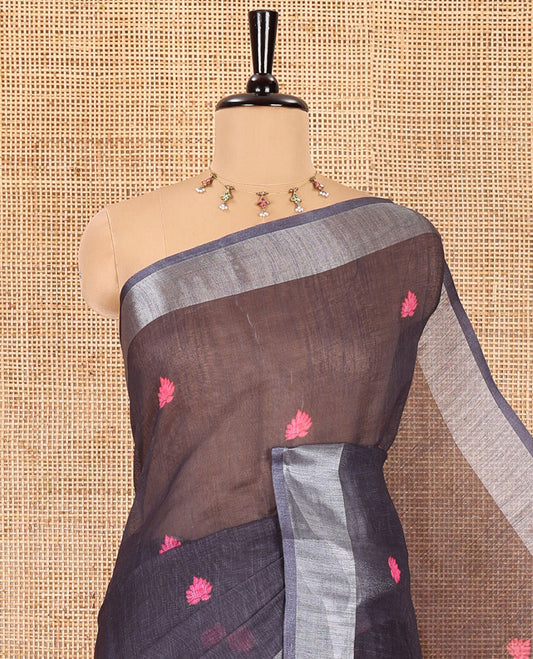 Black floral buttas printed linen cotton saree, zari border, contrast kalamkari floral vine printed pallu, and kalamkari floral vine printed blouse