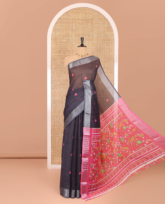 Black floral buttas printed linen cotton saree, zari border, contrast kalamkari floral vine printed pallu, and kalamkari floral vine printed blouse