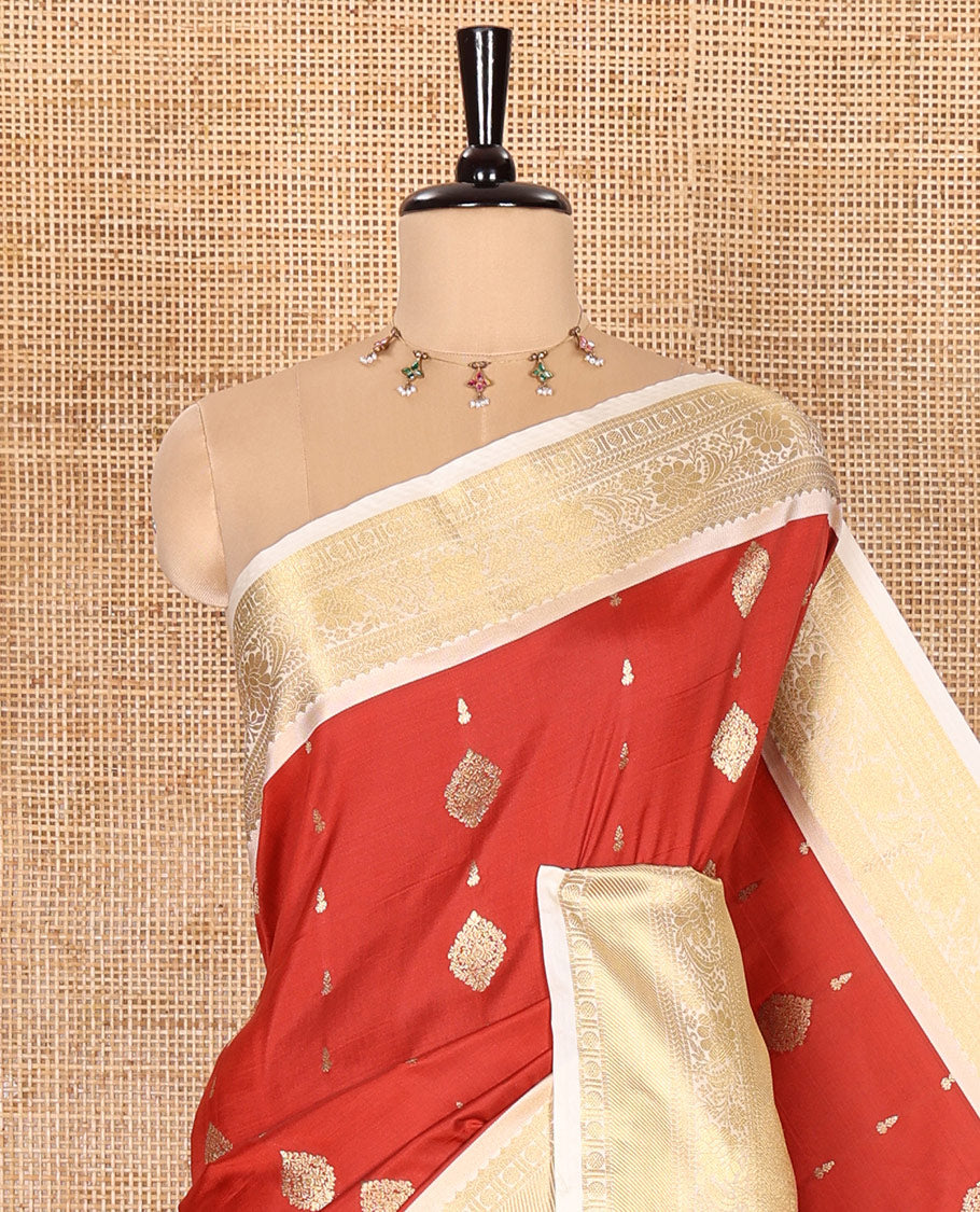 Red Soft Silk Saree Decked Up with Antique Zari Buttas, Complemented with a Contrast Traditional Zari Design Steeped Border, Adorned with Intricate Pallu, and a Contrast Blouse