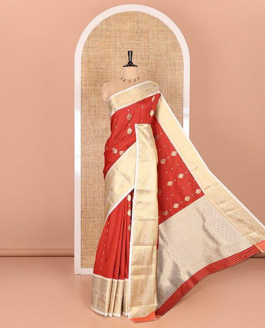 Red Soft Silk Saree Decked Up with Antique Zari Buttas, Complemented with a Contrast Traditional Zari Design Steeped Border, Adorned with Intricate Pallu, and a Contrast Blouse